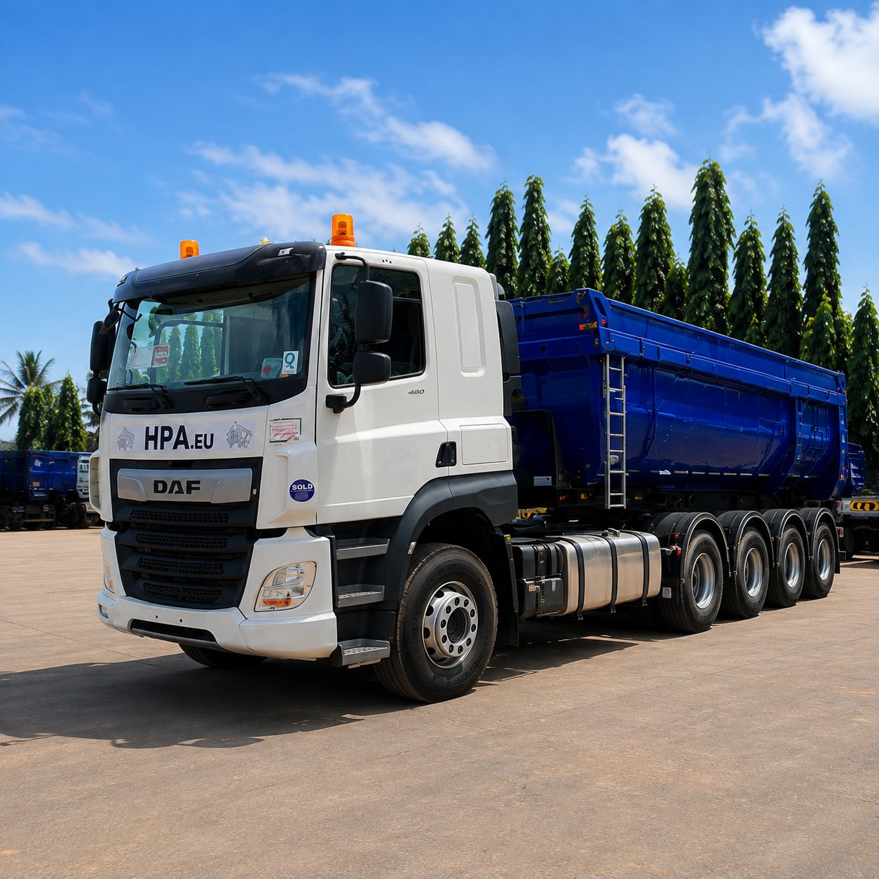 Tracteur DAF attelé à une benne, prêt au départ